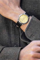 Waldan Heritage Professional Ref. 0196SC with yellow dial and premium leather strap, worn with classic gray shirt